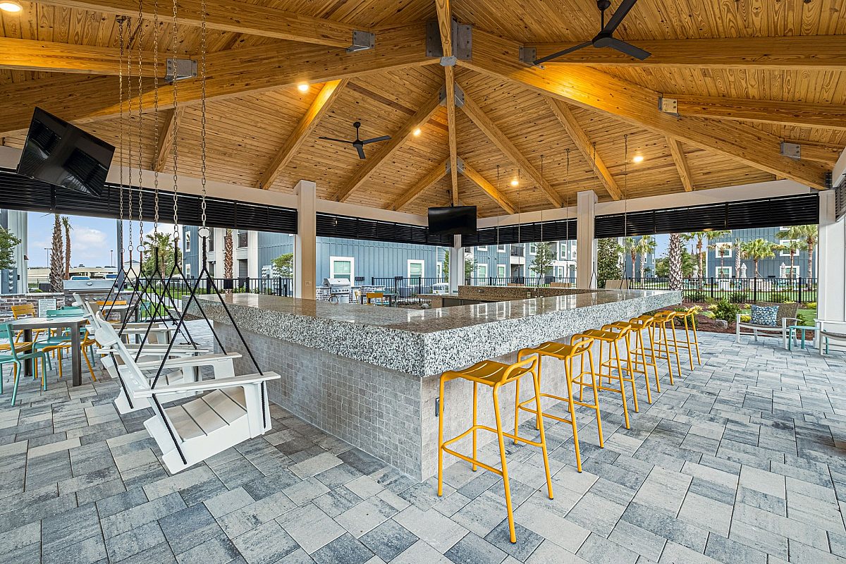 grilling area with counter and chairs