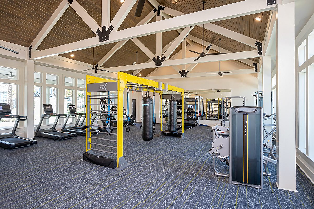 fitness gym with treadmills, punching bags, and stationary bike