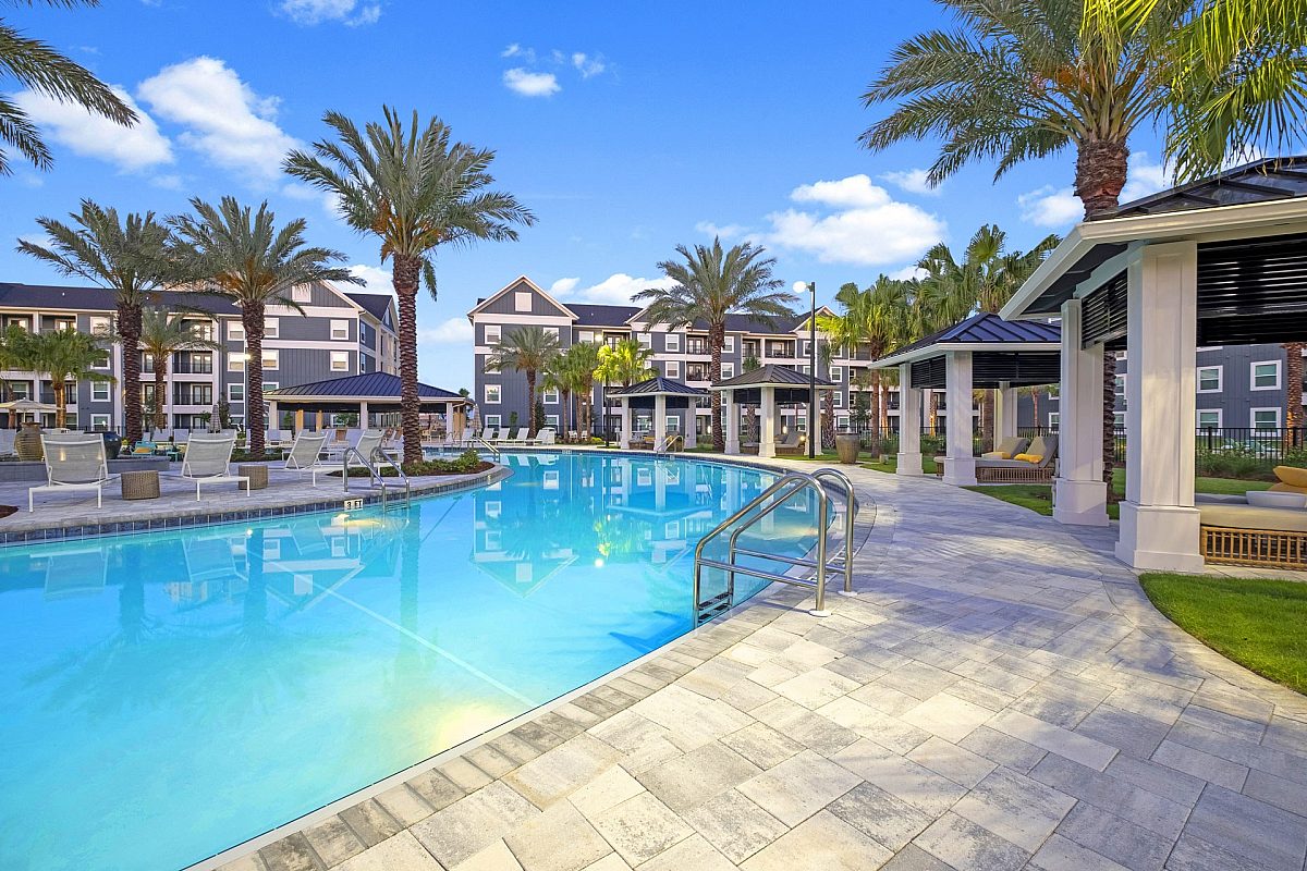 apartment complex outdoor swimming pool with palm trees