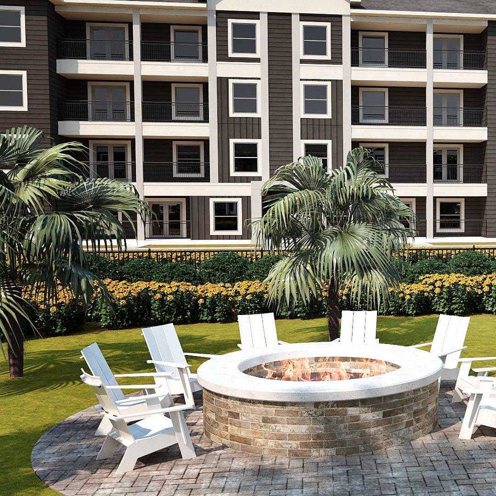 Panama Flats' fire pit in brick finishes with wooden chairs.